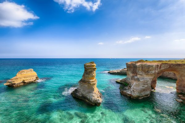 Picturesque seascape with cliffs, rocky arch at Torre Sant Andrea