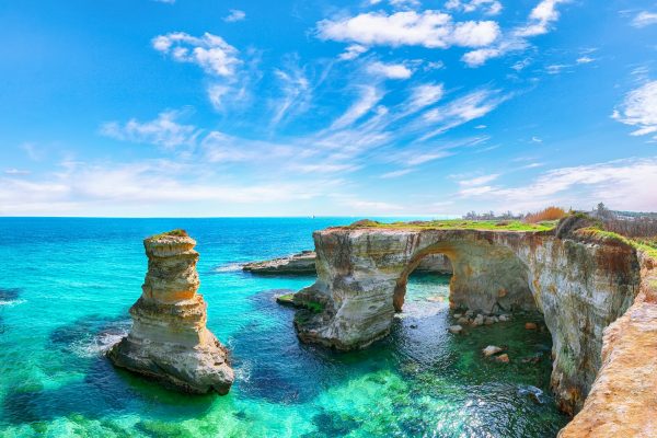 Picturesque seascape with cliffs, rocky arch at Torre Sant Andrea